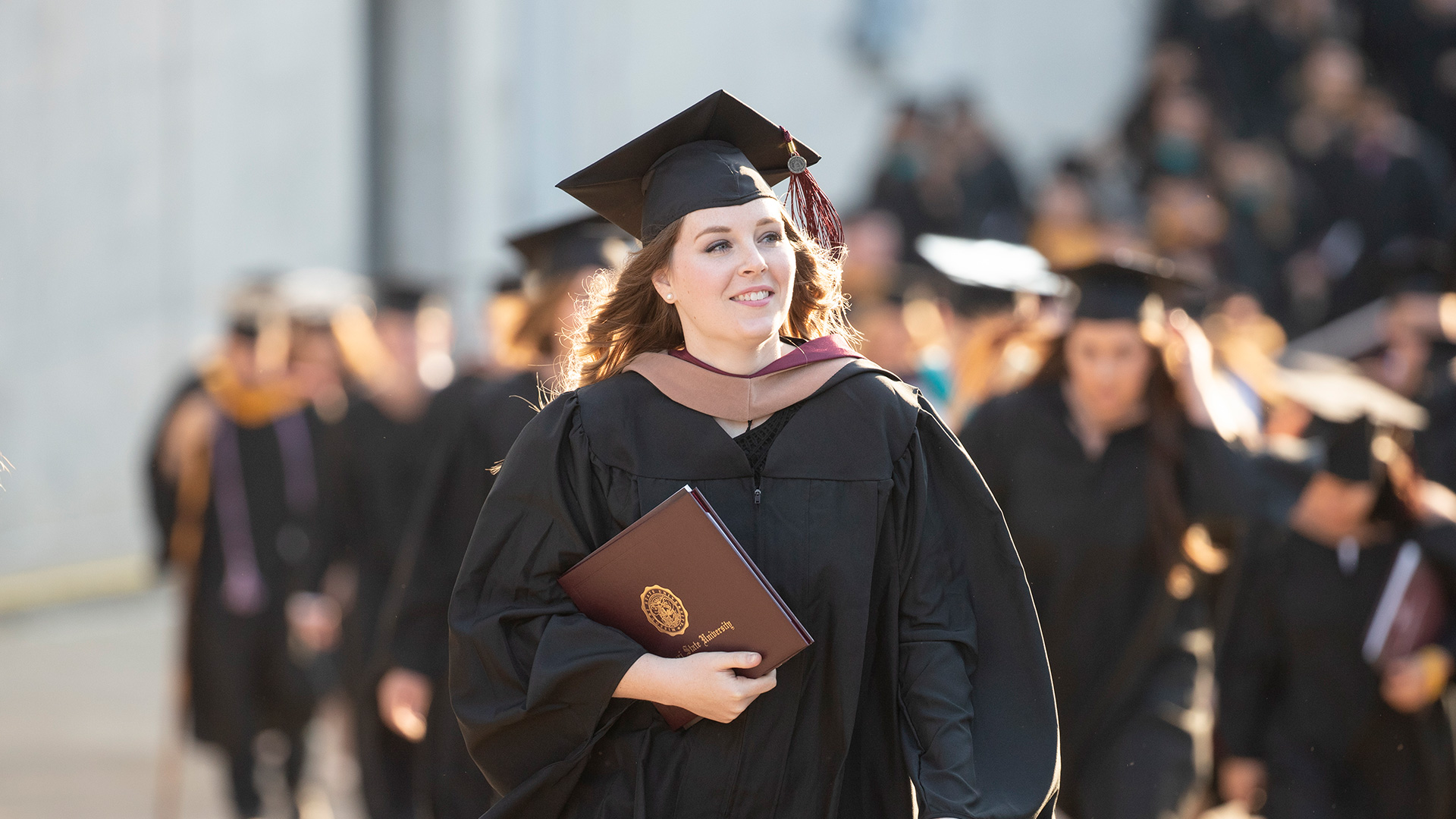 Graduate with diploma