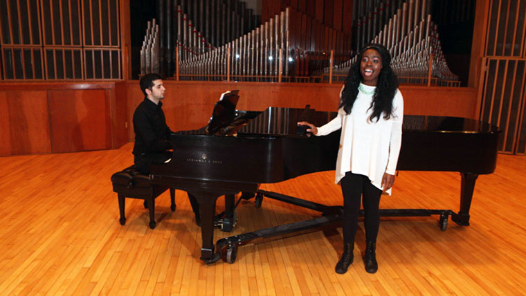 Student sings at piano