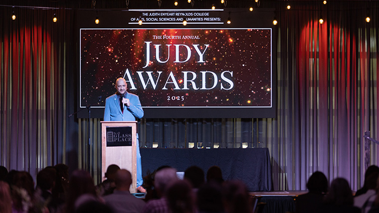 Host speaks on stage